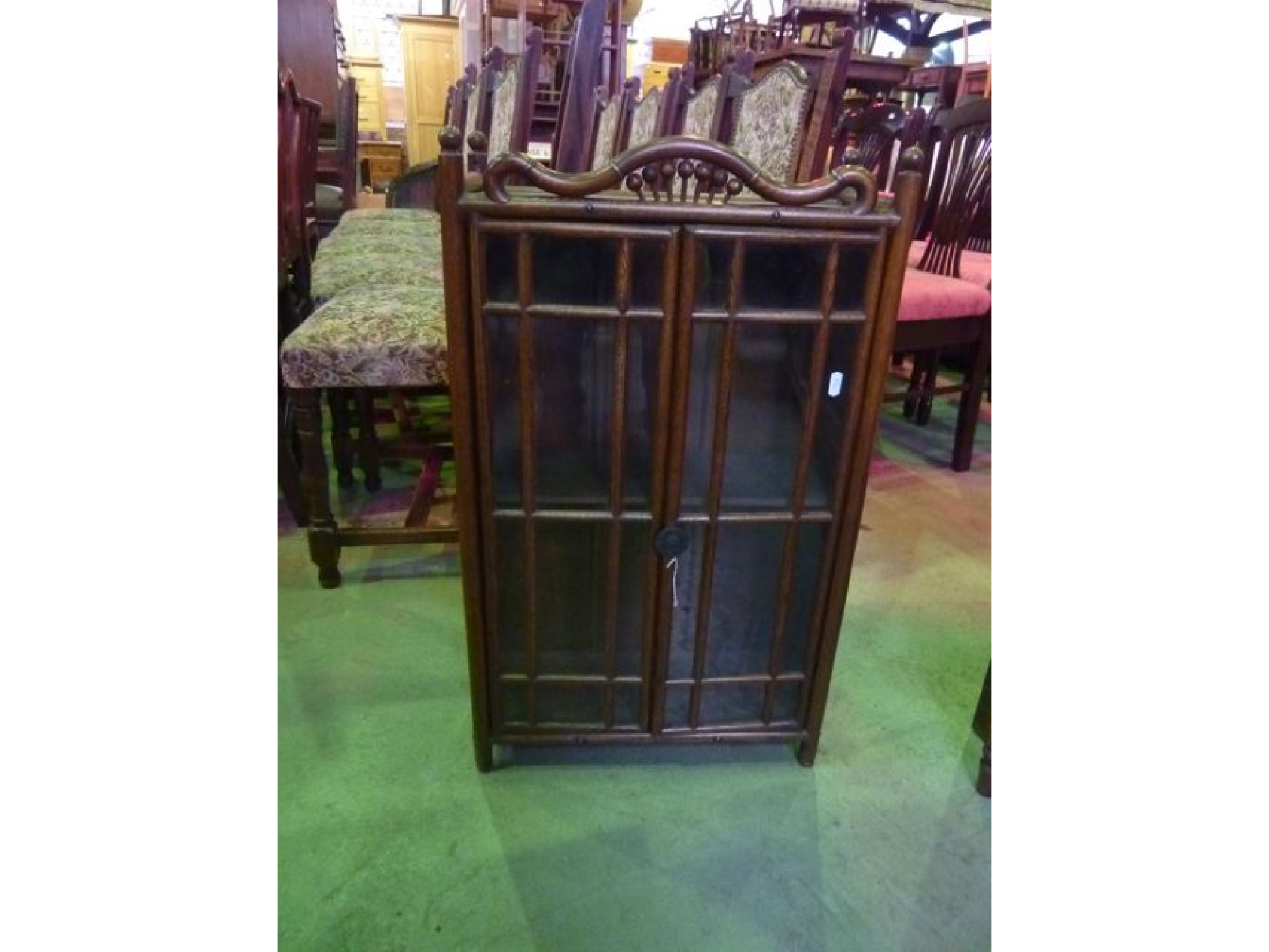 Appraisal: A small th century oak wall mounted cabinet with glazed