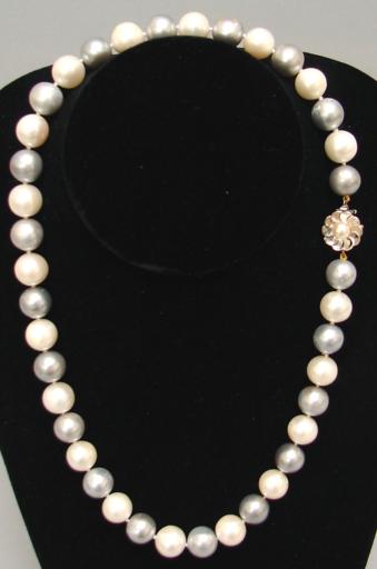 Appraisal: Thirty-nine mm to mm white cultured pearls KW flower pearl