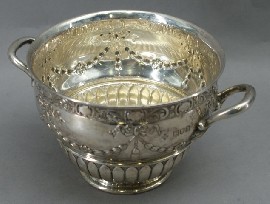 Appraisal: A sterling silver sugar bowl by Walker Hall London