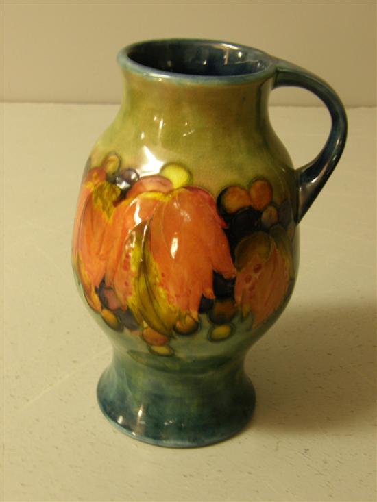 Appraisal: Moorcroft jug decorated with autumn leaves and berries signed and