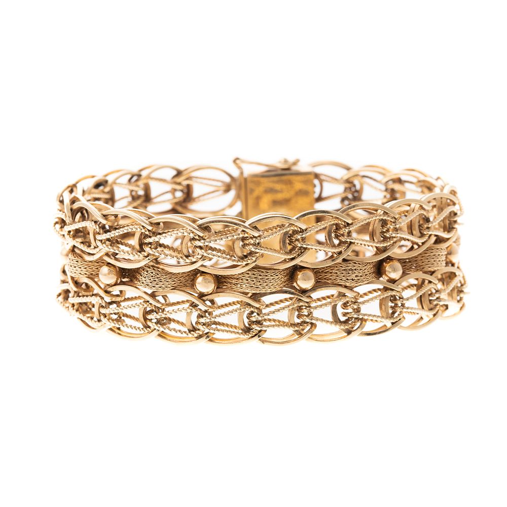 Appraisal: A Wide Woven Braid Bracelet in K K yellow gold