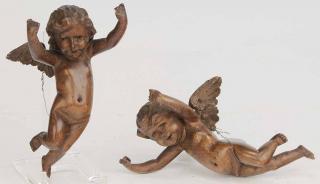 Appraisal: Two Carved Wood Putti with holes in heads and hands