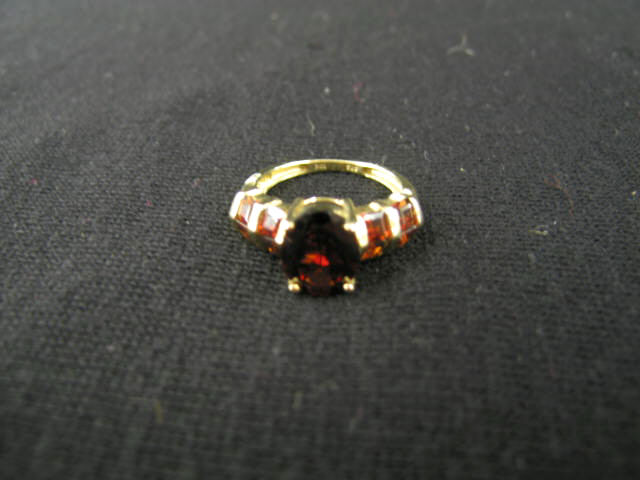 Appraisal: Garnet Ring rich oval gem with step cut gems on