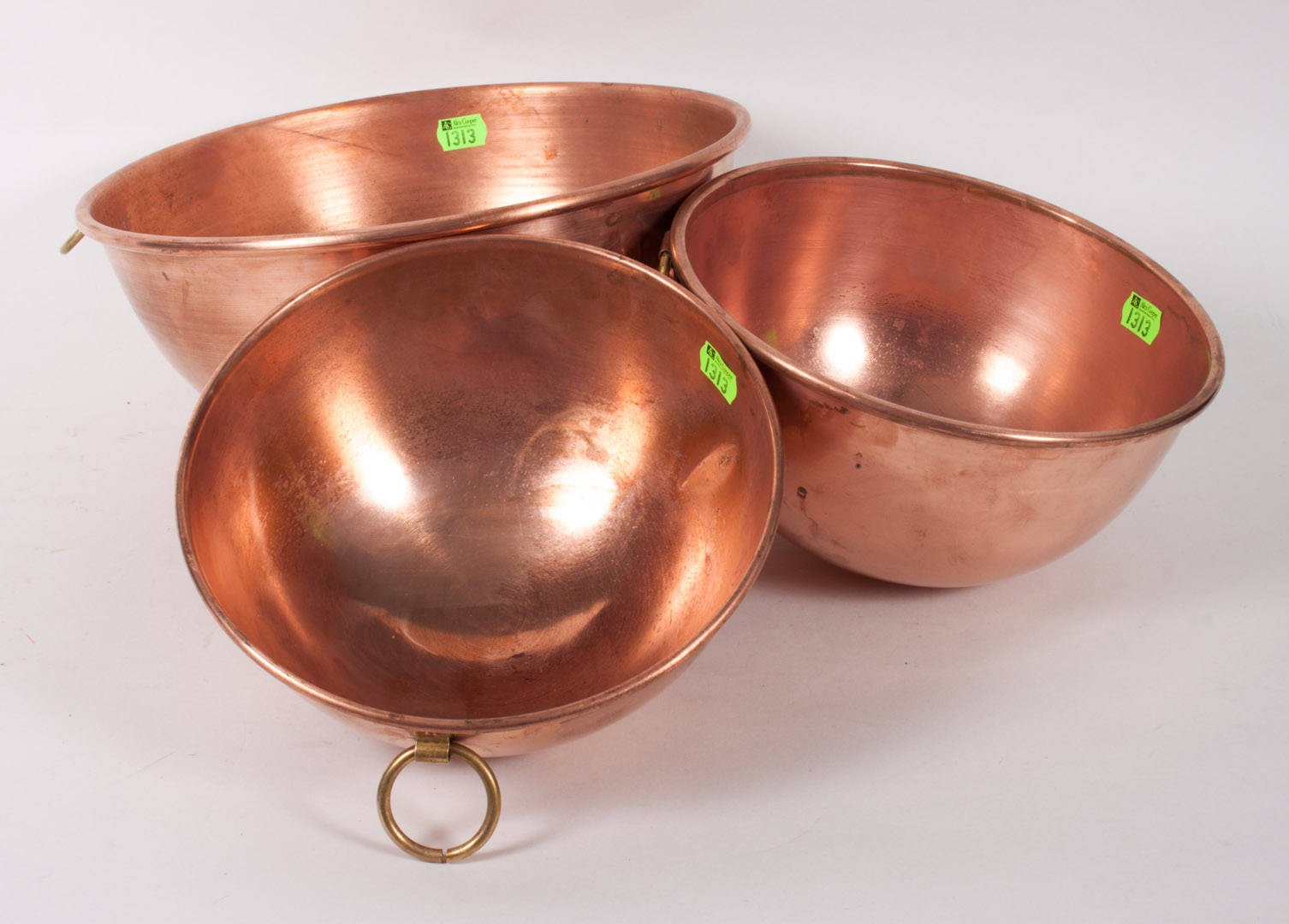 Appraisal: Three French copper and brass mixing bowls copper bowls with