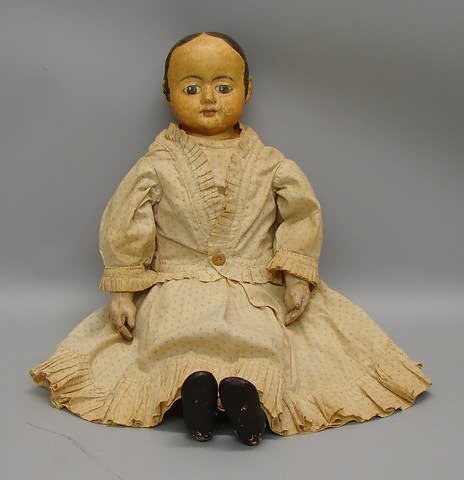 Appraisal: Unmarked papier mache shoulderhead doll with molded hair and features