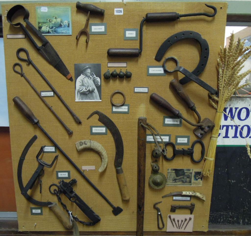 Appraisal: A mounted montage of vintage agricultural related hand tools etc