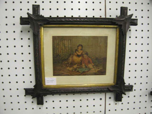 Appraisal: Victorian Chromolithograph of Children with doll cats carved walnut frame