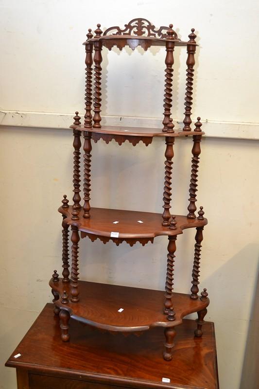 Appraisal: A VICTORIAN SERPENTINE MAHOGANY WHAT-NOT A VICTORIAN SERPENTINE MAHOGANY WHAT-NOT