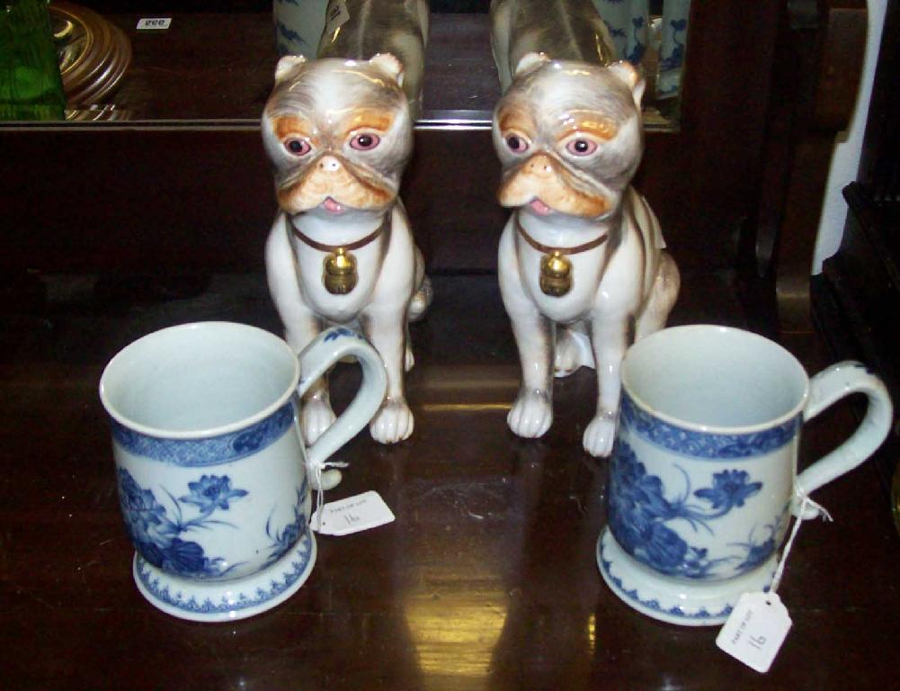 Appraisal: A pair of Sutherland bone china pug dogs and two