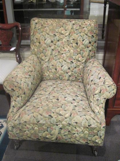 Appraisal: Victorian upholstered club chairThe rounded sloped back and scrolling arms