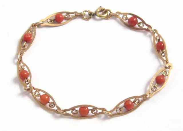 Appraisal: CORAL AND FOURTEEN KARAT GOLD CHAIN BRACELET inches in length