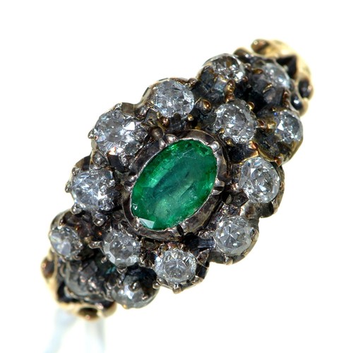 Appraisal: An emerald and diamond ring gold hoop with chased bifurcated