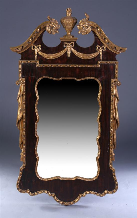 Appraisal: GEORGIAN STYLE MAHOGANY AND PARCEL-GILT WALL MIRROR th century Scrolling