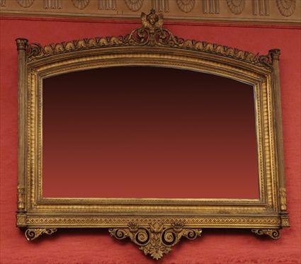 Appraisal: NEO-GREC CARVED GILTWOOD WALL MIRROR The arched mirror plate in