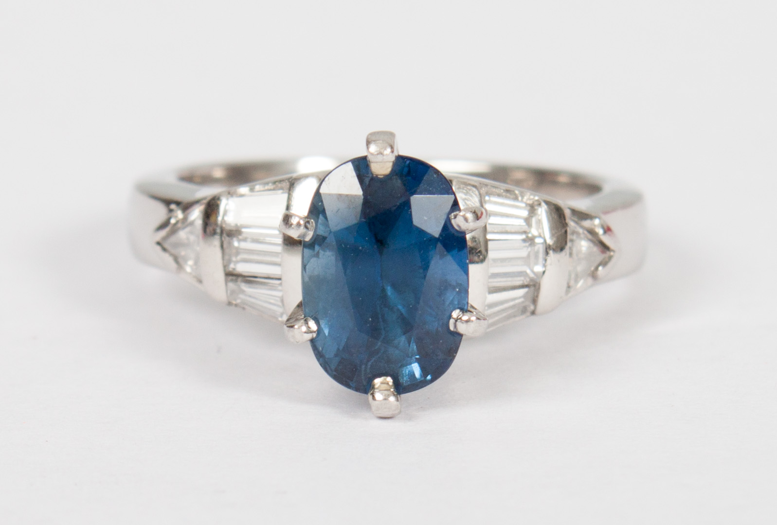 Appraisal: Lady's platinum blue sapphire diamond ring center oval-shaped blue sapphire