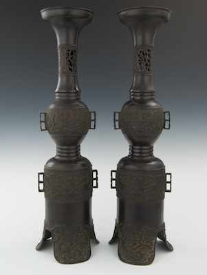 Appraisal: A Pair of Decorative Chinese Style Candle Stands Achaistic style