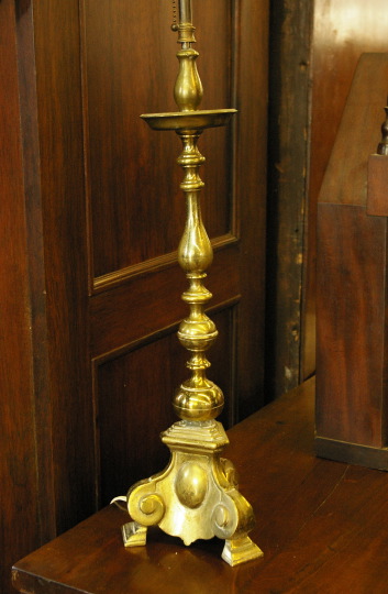 Appraisal: Continental Weighted Brass Tripodal Candlestick in the early th-century style