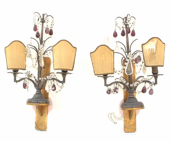 Appraisal: A pair of patinated metal two light wall sconces height