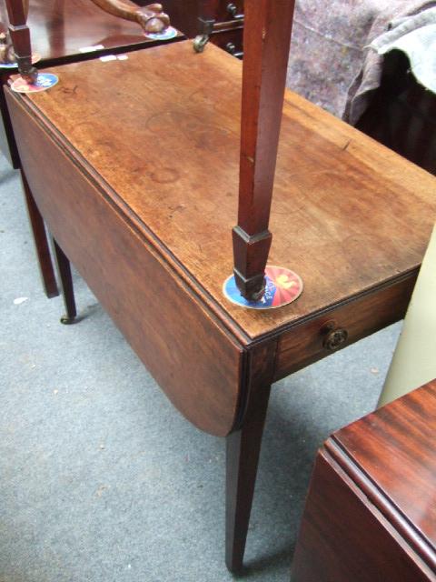 Appraisal: A th century mahogany Pembroke table with single frieze drawer