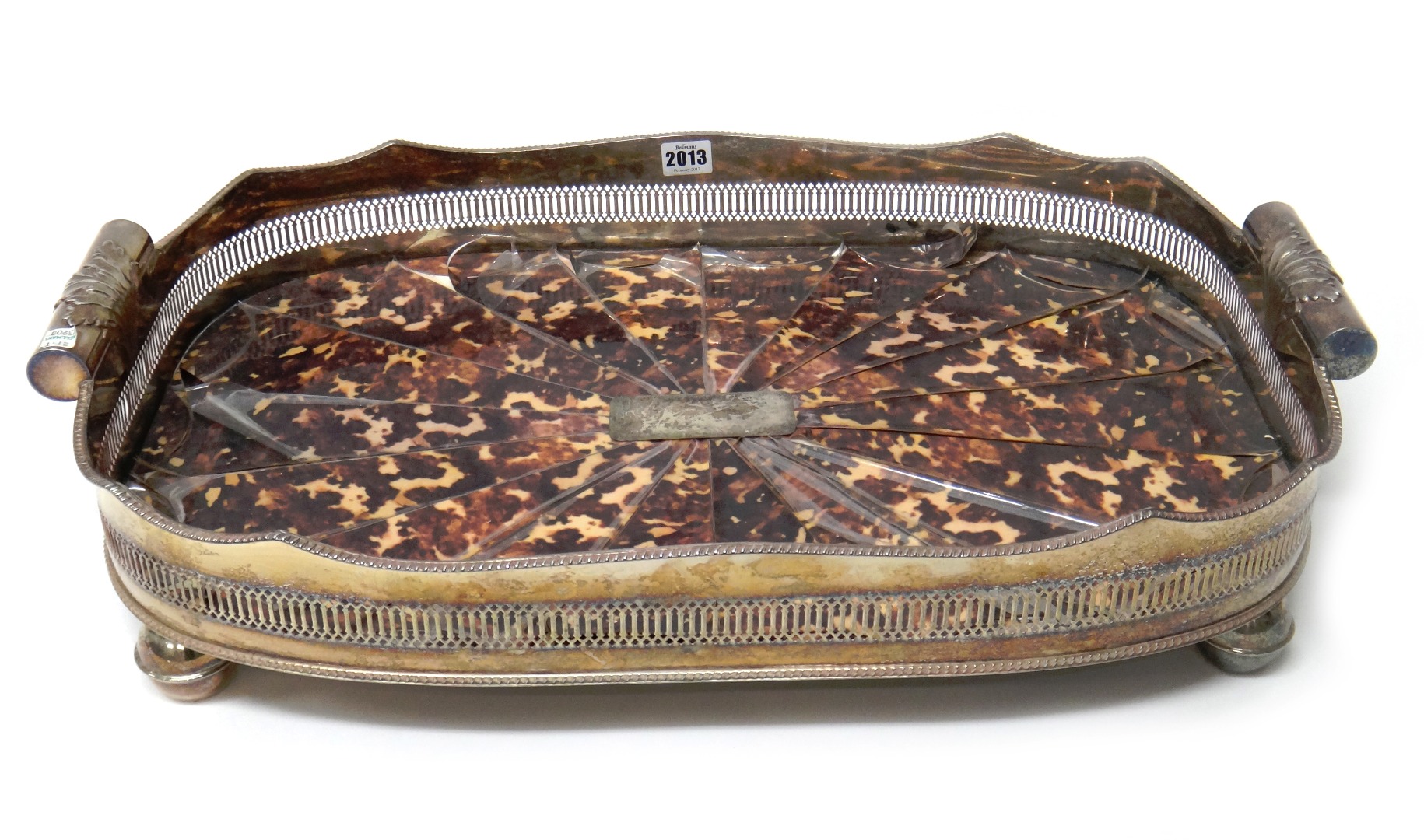 Appraisal: A silver plated curved rectangular twin handled gallery tray the