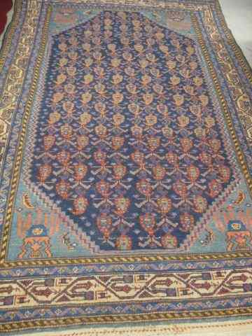 Appraisal: Semi-Antique Persian Handmade Rug interesting repeating design on dark blue