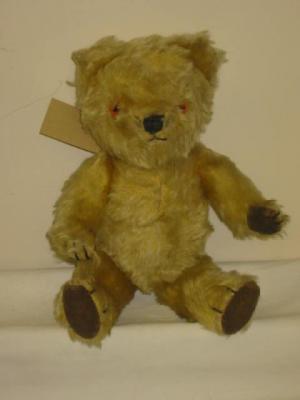 Appraisal: A Chad Valley teddy bear covered in long gold plush