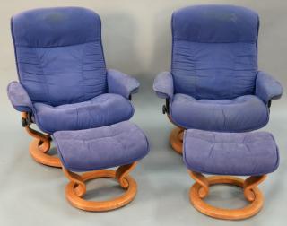 Appraisal: Pair of Contemporary swivel reclining chairs and ottomans Pair of