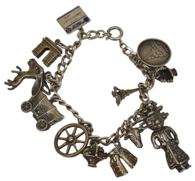 Appraisal: Sterling silver charm bracelet with twelve charms including Western Union