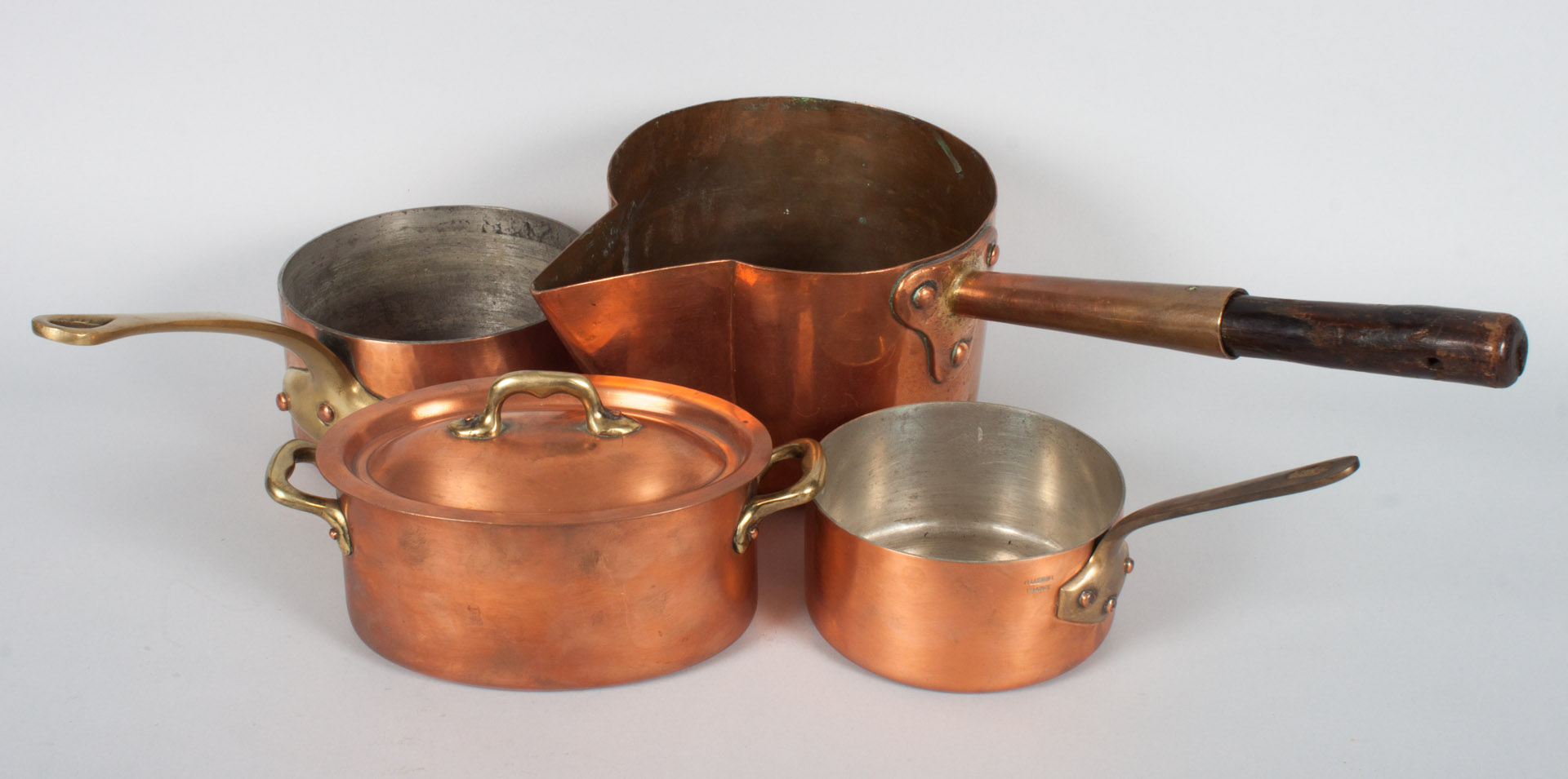 Appraisal: Four French cooper cooking utensils each with applied brass handles