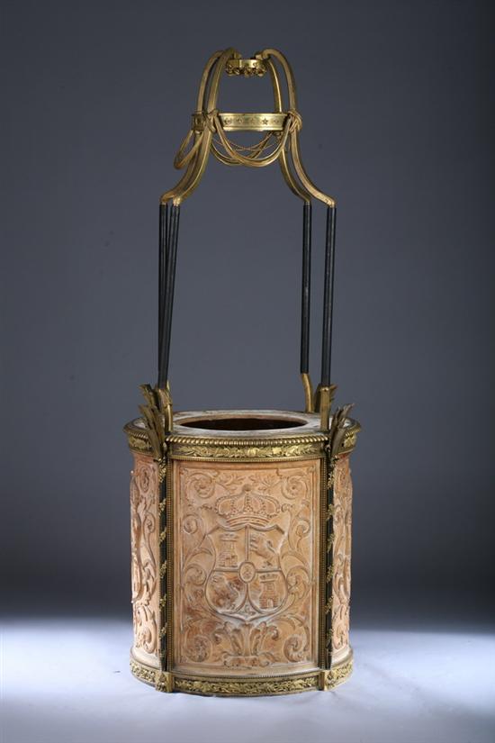 Appraisal: CONTINENTAL GILT BRASS-MOUNTED BAS RELIEF CAST COMPOSITION WISHING WELL th