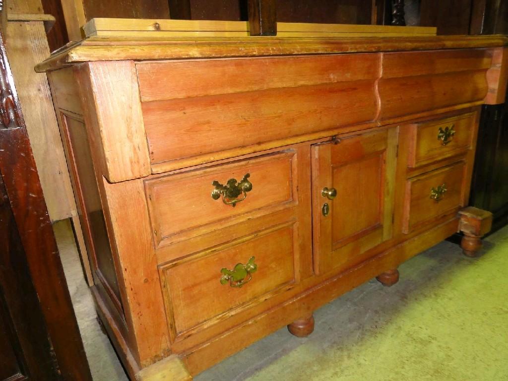 Appraisal: A Victorian stripped pine dresser fitted with an arrangement of