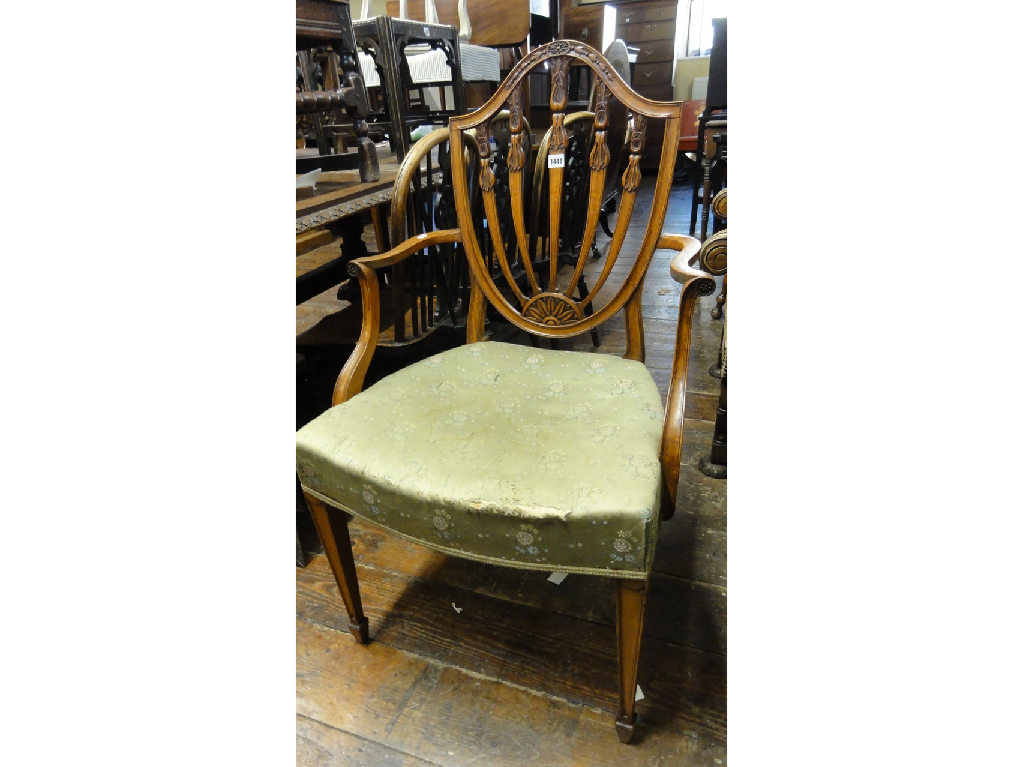 Appraisal: A th century Hepplewhite style shield back elbow chair in