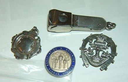 Appraisal: A silver cigar cutter together with a Gordon Highlanders silver