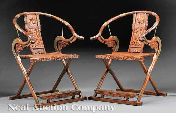 Appraisal: A Pair of Chinese Brass-Mounted Hardwood Folding Horseshoe Back Armchairs