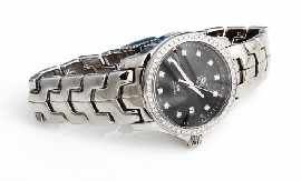 Appraisal: A stainless steel lady's Tag Heuer 'Link' quartz wristwatch with