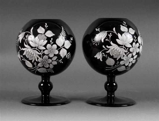 Appraisal: Pair of floral enamel decorated black glass globular pedestal vases