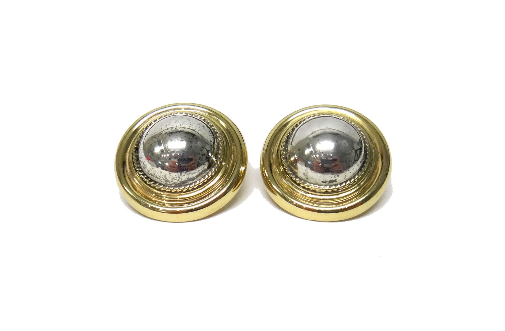 Appraisal: A pair of gold and silver earclips each of circular