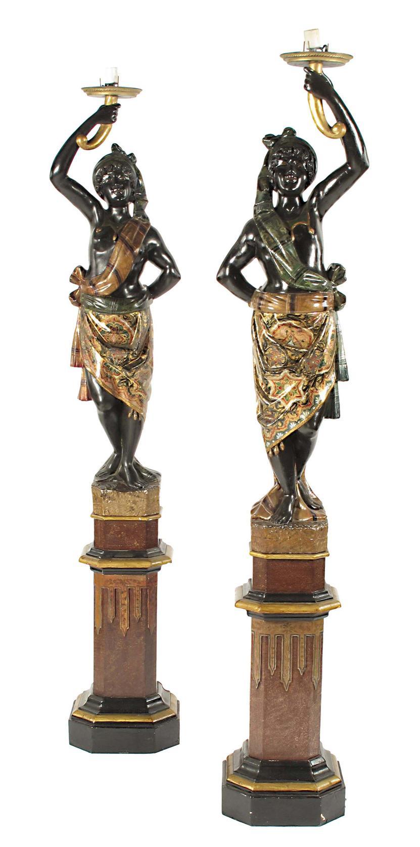 Appraisal: A pair of Venetian style polychrome decorated and giltwood Blackamoor