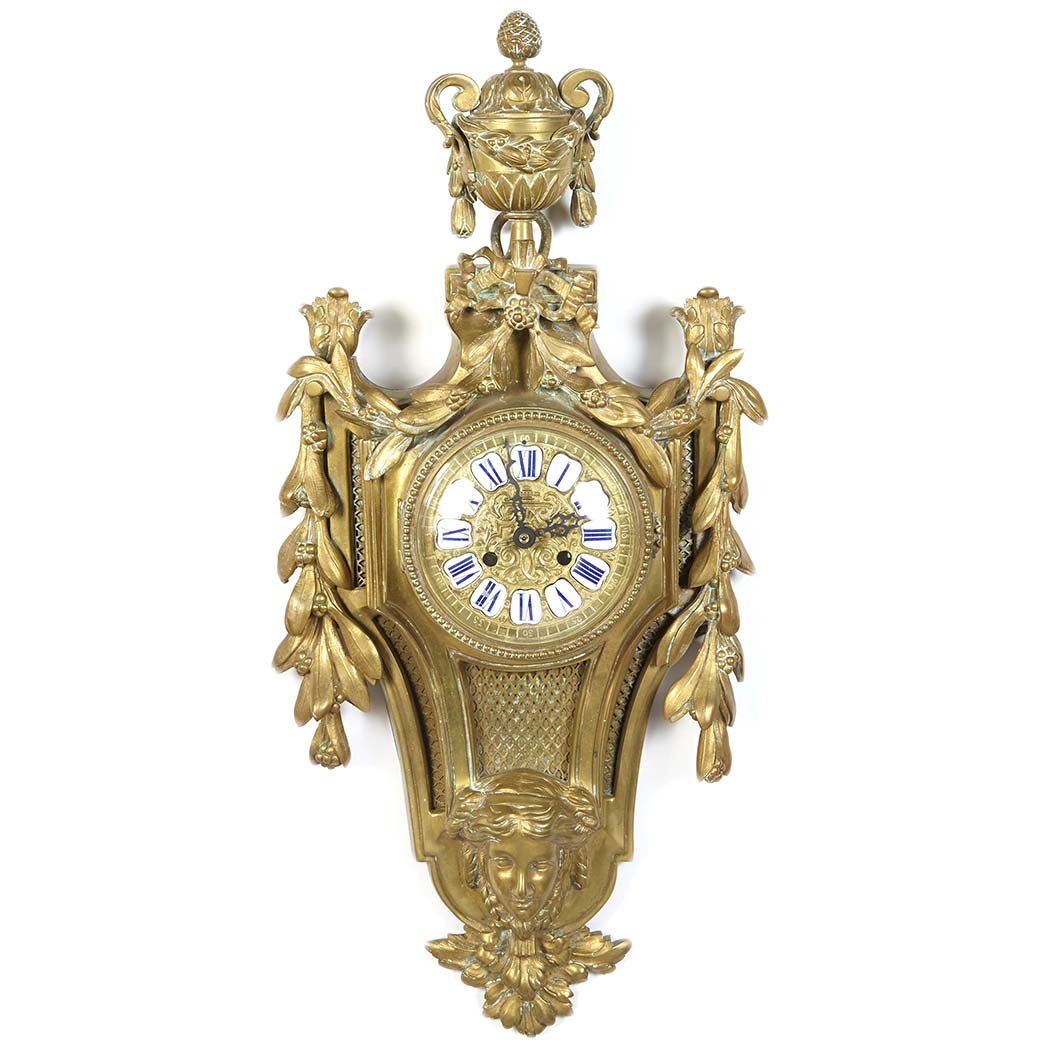 Appraisal: Louis XVI Style Metal Cartel Clock The circular dial with