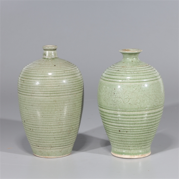 Appraisal: Two Chinese celadon glazed ceramic vases with incised floral designs