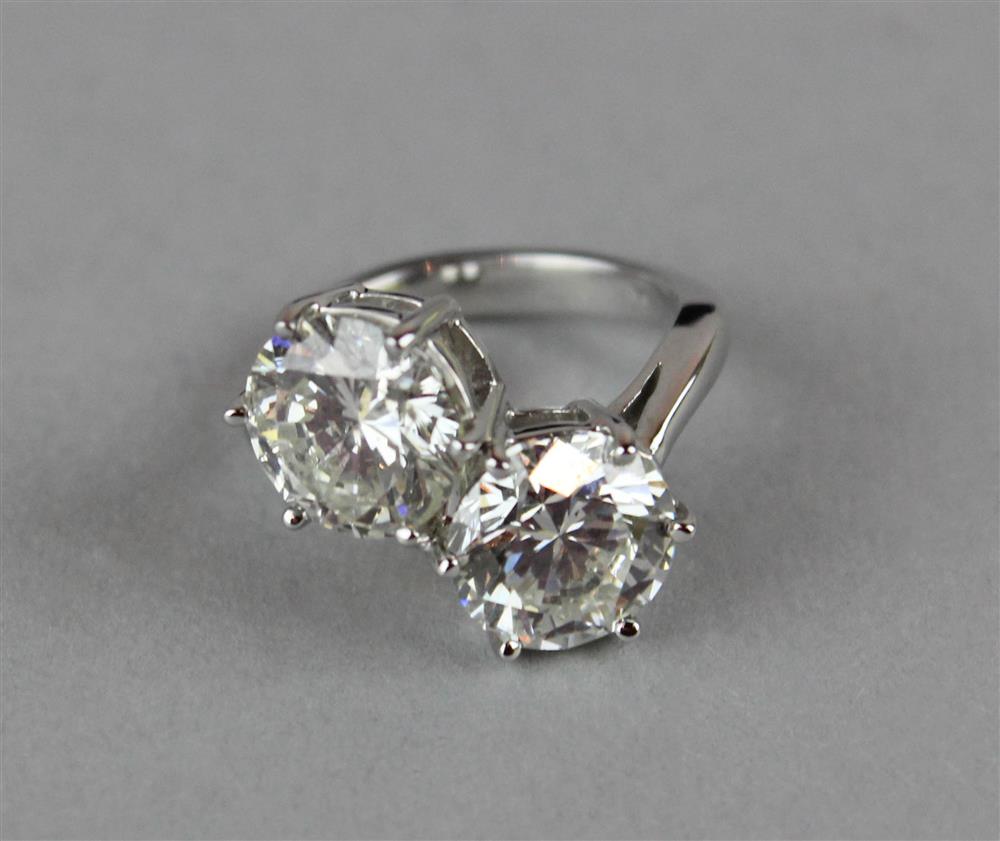 Appraisal: TWO-STONE DIAMOND BYPASS RING the two brilliant cut white diamonds