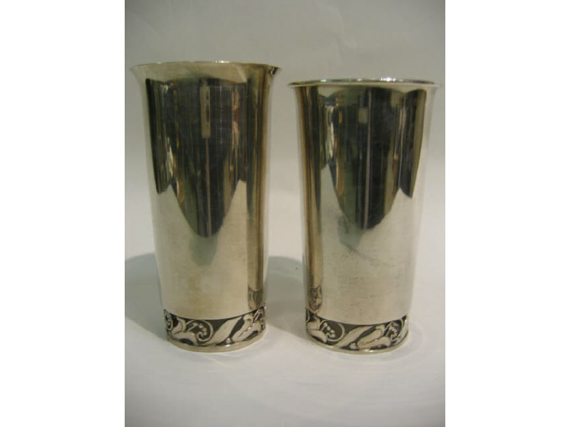 Appraisal: TWO DANISH STERLING SILVER CUPS with pierced floral decorated bases