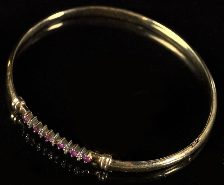 Appraisal: Fourteen-Karat Yellow Gold Ruby and Diamond Bangle Bracelet composed of