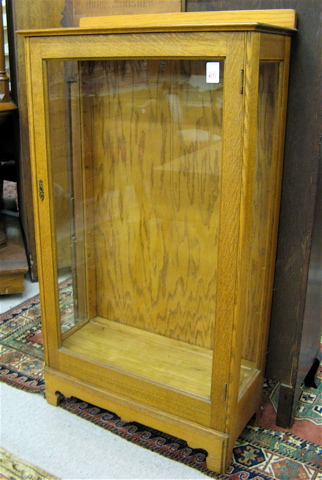 Appraisal: AN OAK CABINET BOOKCASE OR DISPLAY CABINET American c having