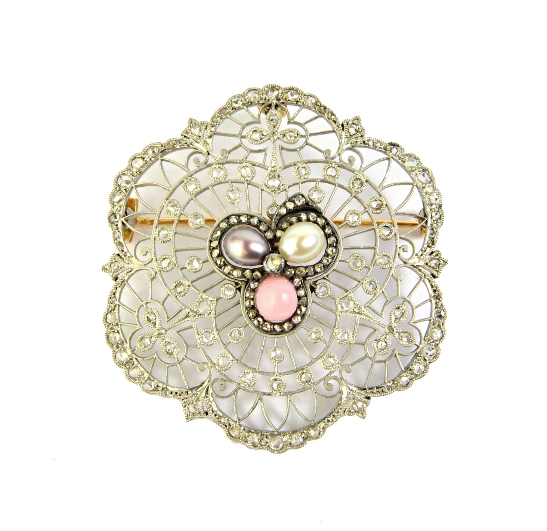 Appraisal: A diamond and vary coloured cultured pearl brooch in a