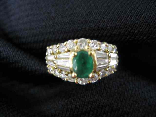 Appraisal: Emerald Diamond Ring carat oval gem surrounded by baguette round