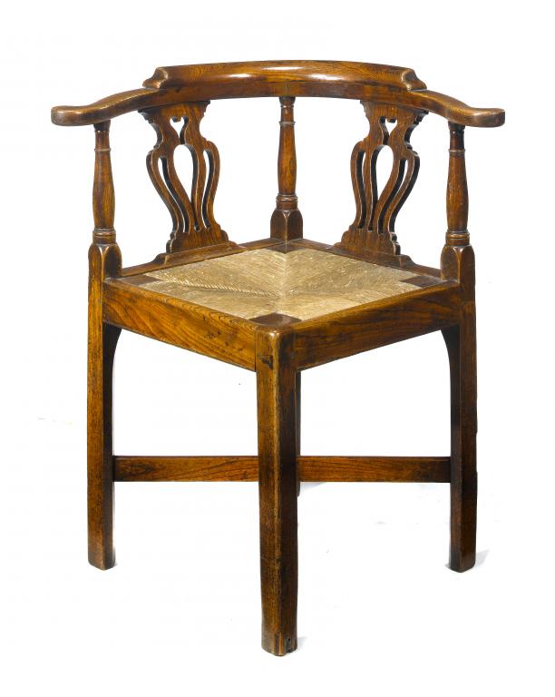 Appraisal: A GEORGE III ELM READING CHAIR with pierced splats and