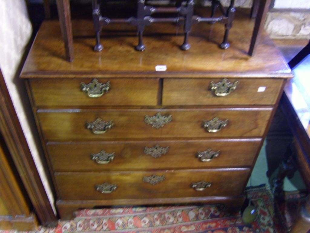 Appraisal: A small Georgian mahogany chest of long and short drawers