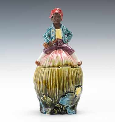 Appraisal: Black Americana Figural Majolica Tobacco Jar ca 's Seated black