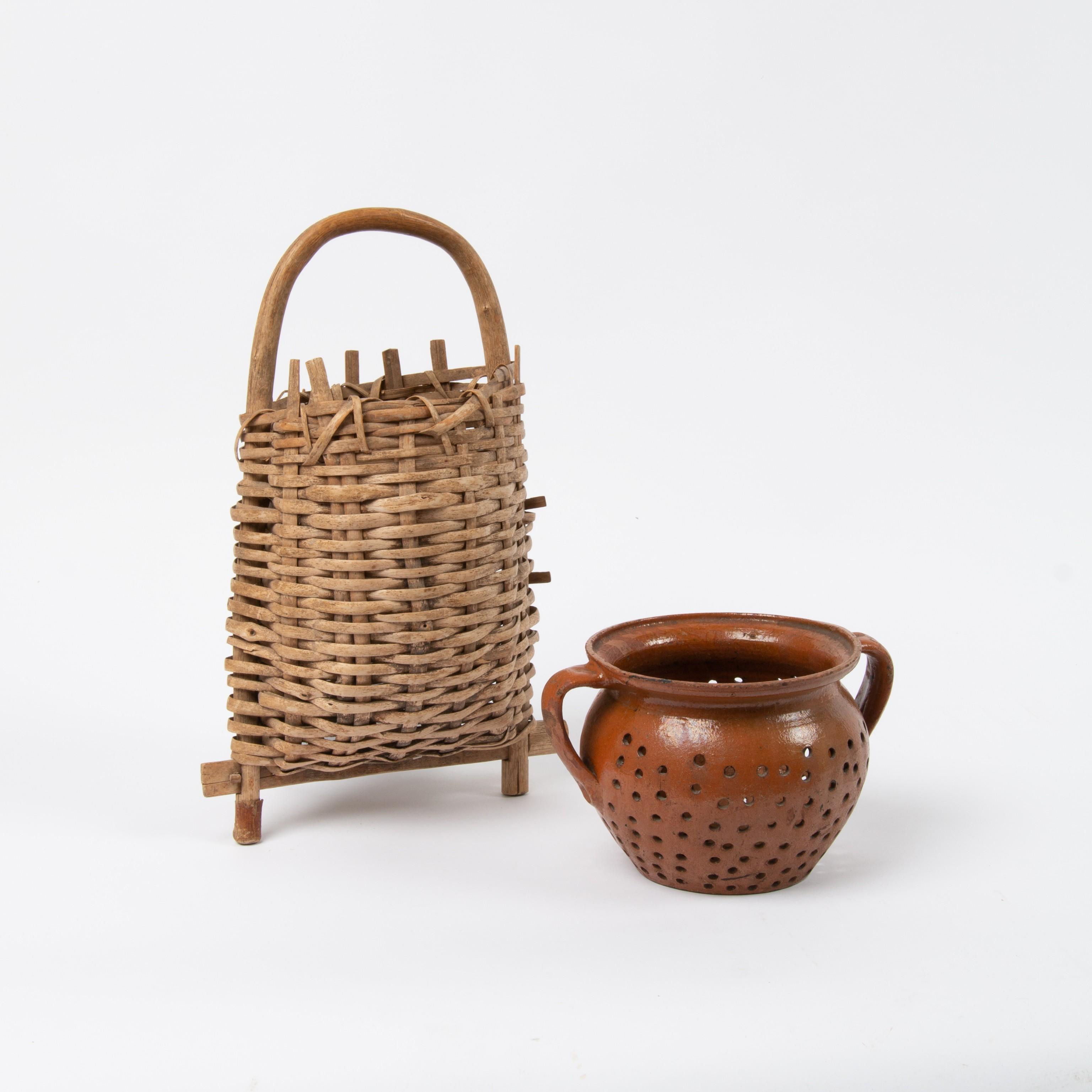 Appraisal: REDWARE CHEESE STRAINER AND UNUSUAL SPLINT BASKET In this lot